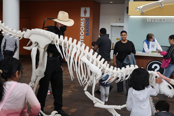 Guests interacting with Mr. Bones