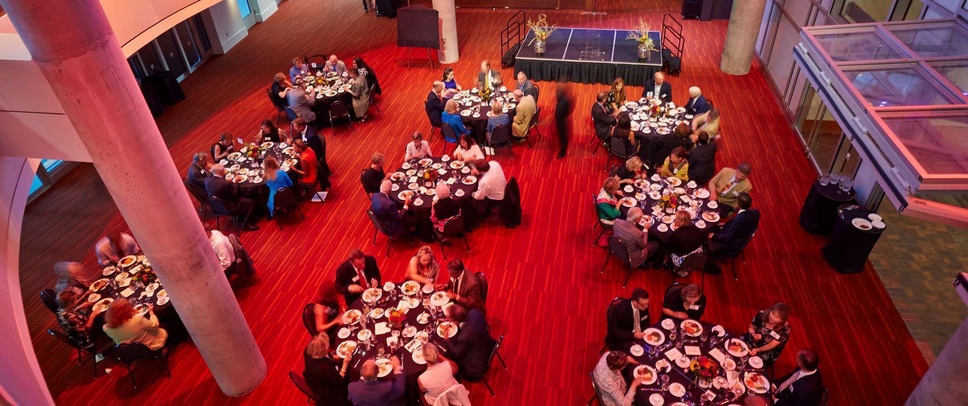 Round tables with people dining 