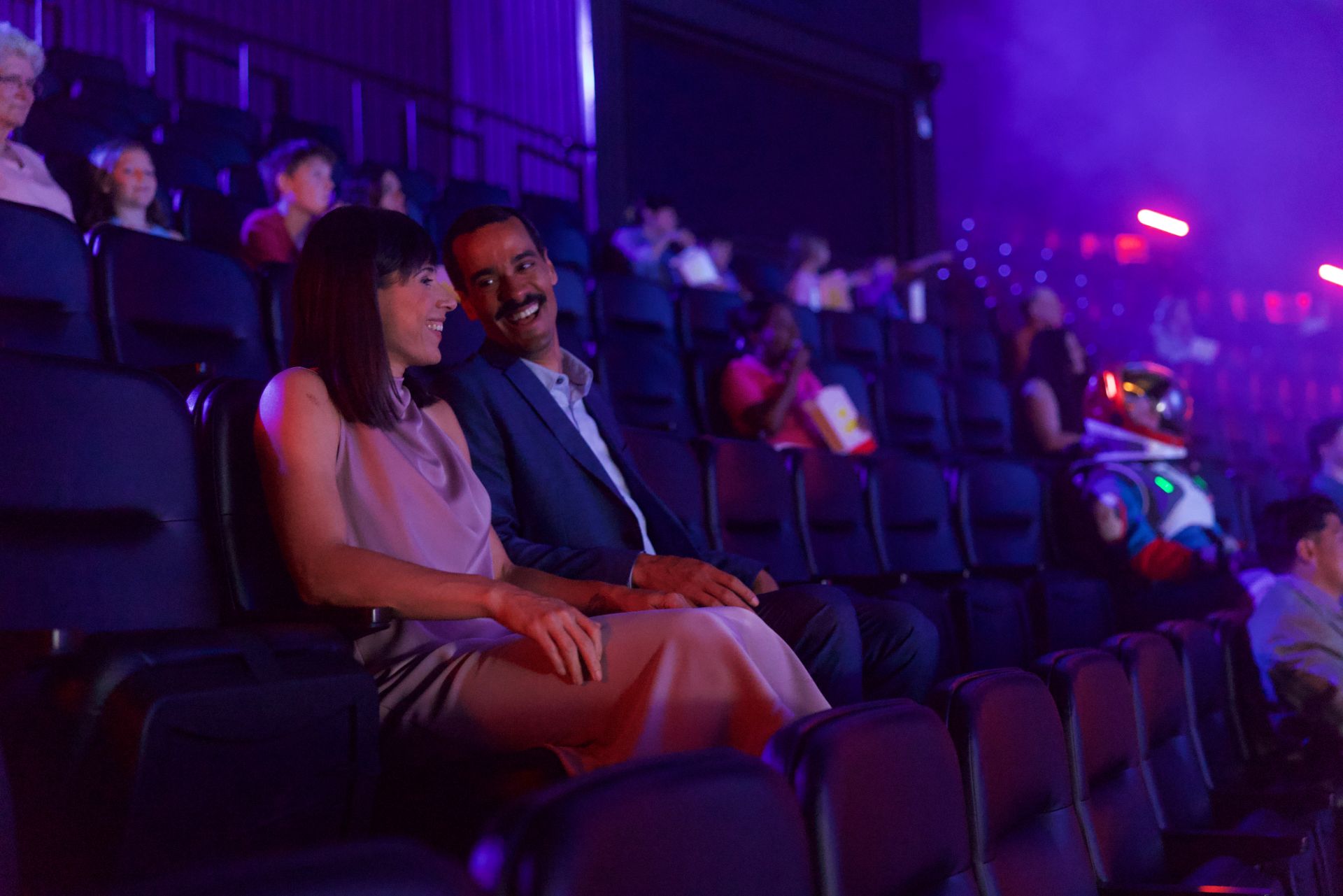 Guests enjoying film inside Infinity Theater