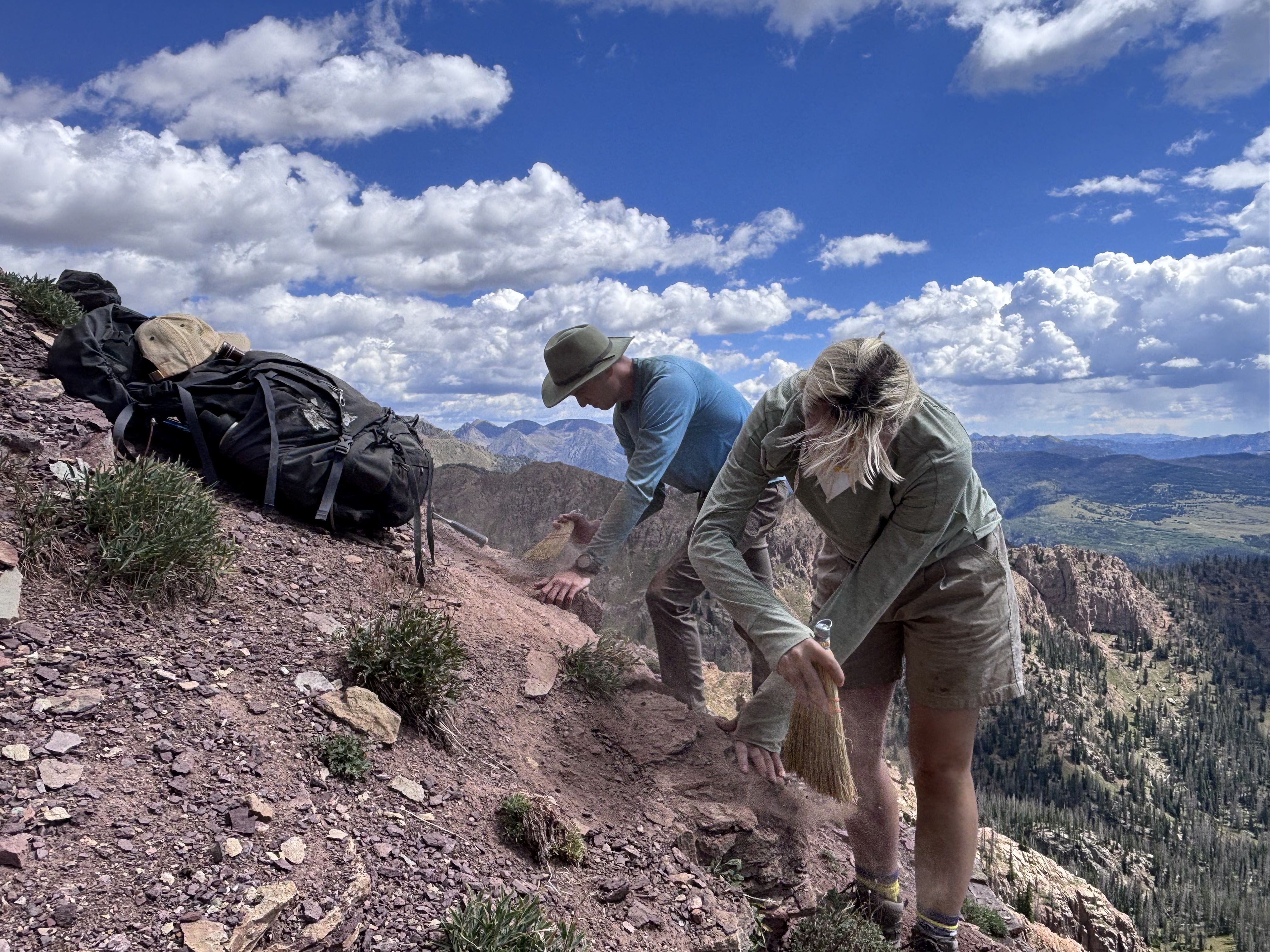 University of Chicago PhD candidate, Franklin Duffy (former digital preparator at DMNS 2022-2024; left), and Denver Museum of Nature & Science fossil preparator, Sadie Sherman (right), exposing Devonian fish fossil at Endlich Mesa. (Photo/Laurel Trout) 