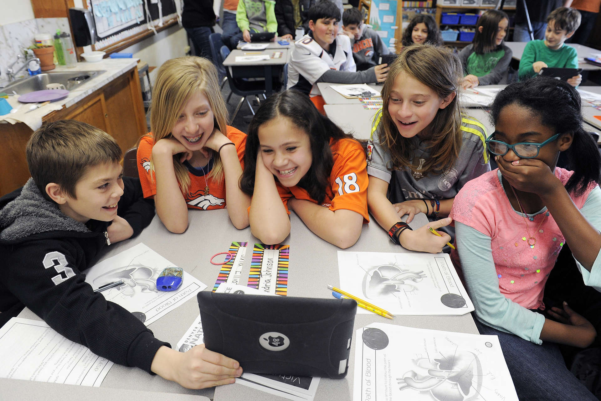 Children connect virtually through a tablet