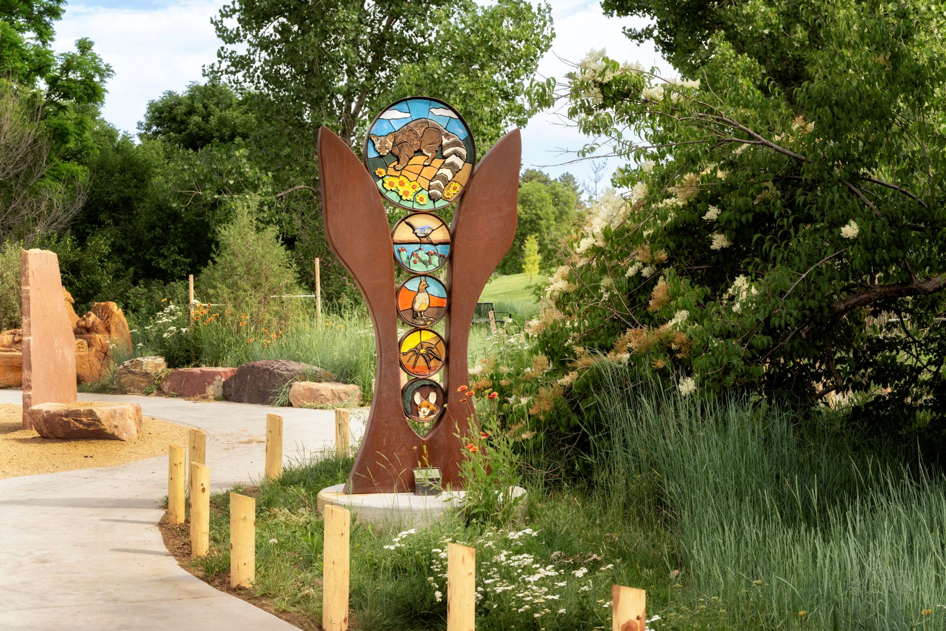 Public art with species from piñon-juniper woodland ecosystem by artist Greg Fields in Nature Play. (Photo/ Rick Wicker)