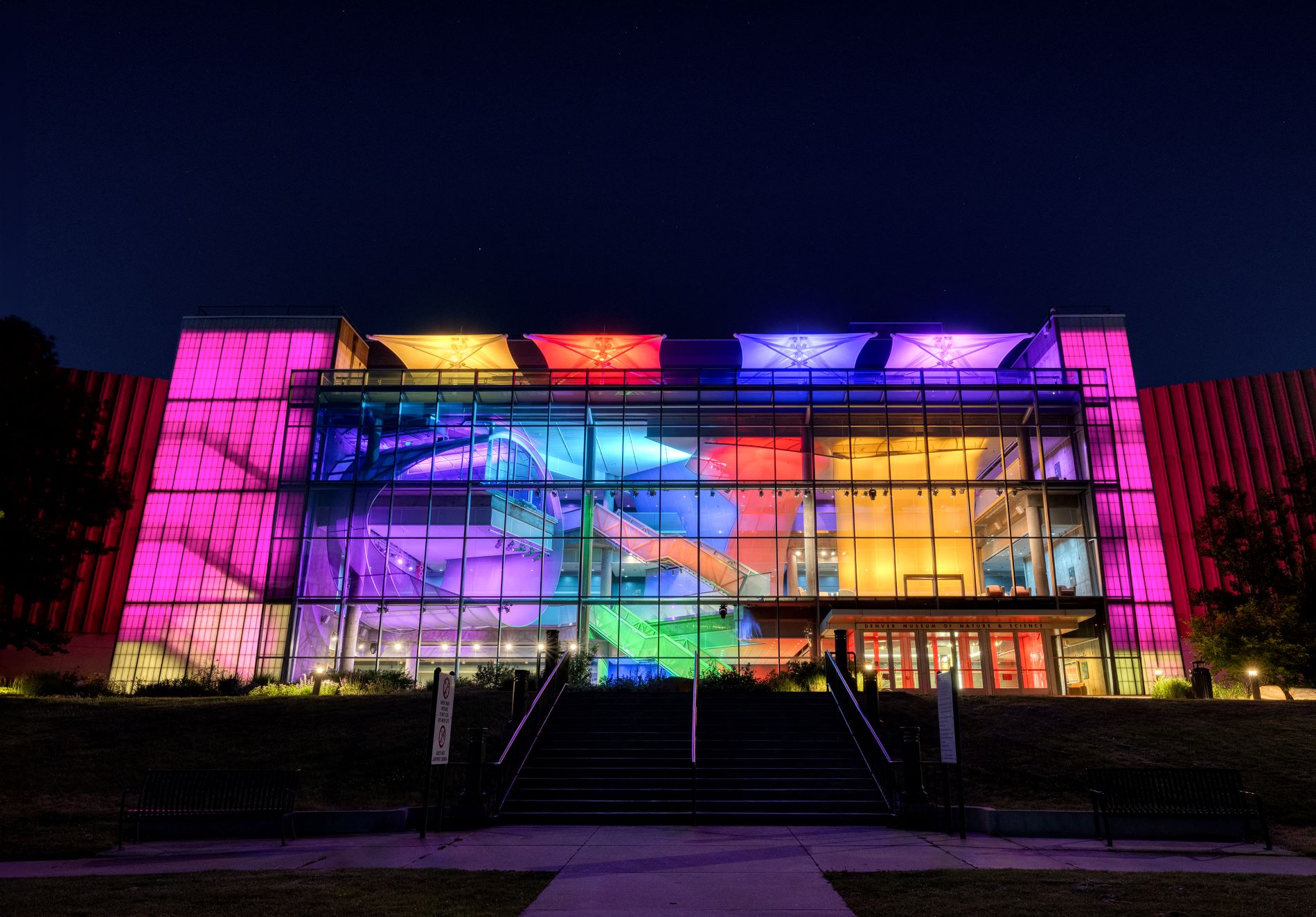 New lighting system turned on in the Denver Museum of Nature & Science's West Atrium as seen from City Park during the night on June 6, 2024. (Photo/ Rick Wicker)